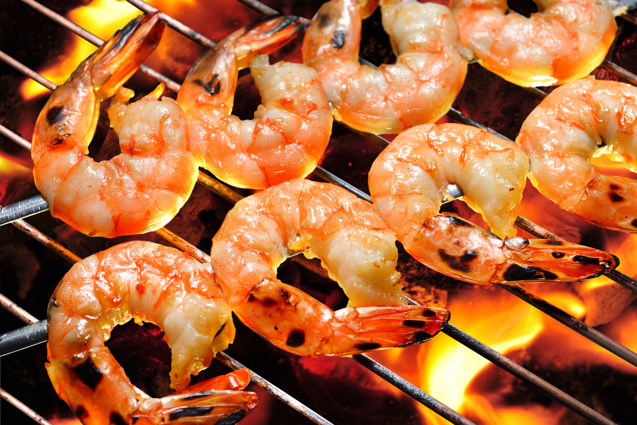 Grilled shrimps on the flaming grill